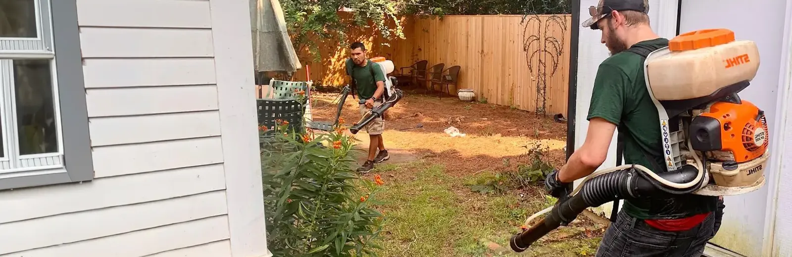 Techs outside spraying for mosquitoes